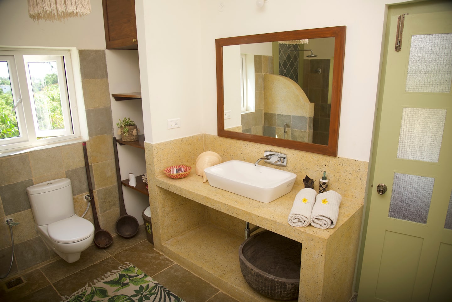 Villa 50 bathroom with a spacious vanity, mirror and basin